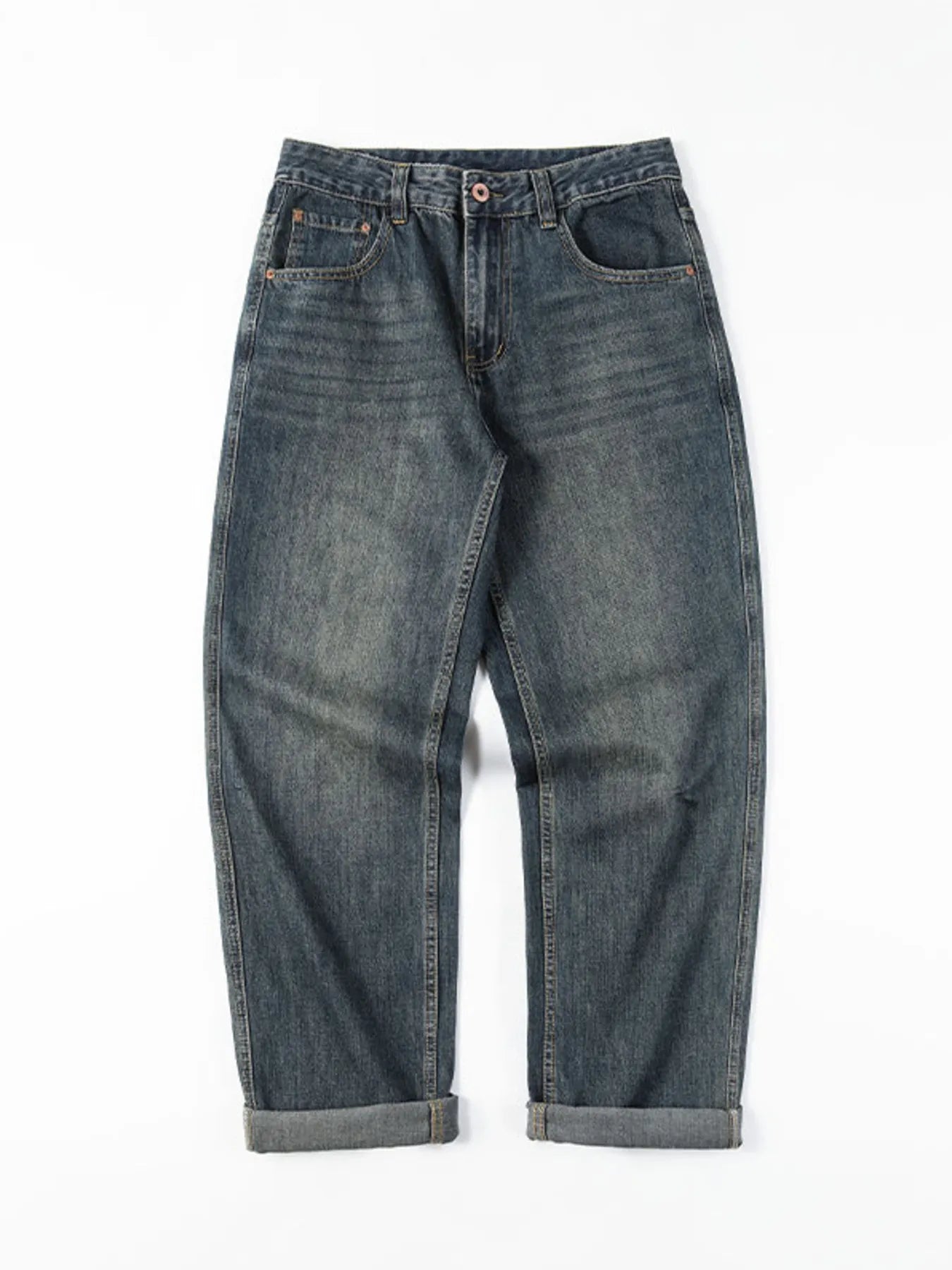 Loose fit blue cotton denim jeans with vintage wash and cuffed hems.