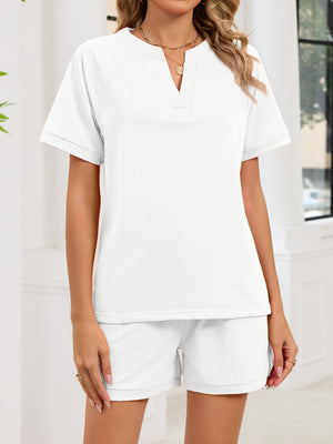 White loungewear shorts and V-neck top ensemble with drawstring waist.