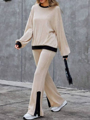 Ribbed knit lounge set in tan with black trim and slit hem pants.