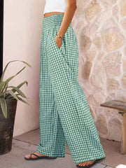 Green plaid maternity pants with smocked waistband and wide legs.