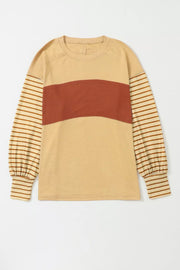 Maternity bishop sleeve shirt in tan with rust colorblock and striped sleeves, crew neck.
