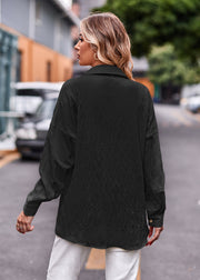 Black textured overshirt with relaxed fit and buttoned cuffs.