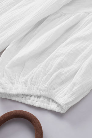 White textured gauze gathered sleeve blouse with elastic cuff detail