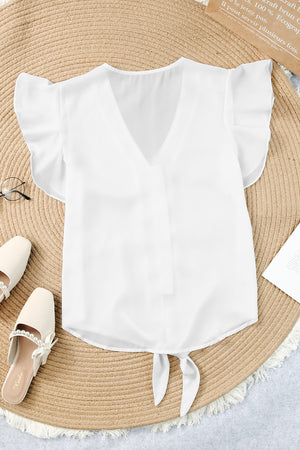 White ruffle sleeve tie-front blouse with V-neckline and flutter sleeves.