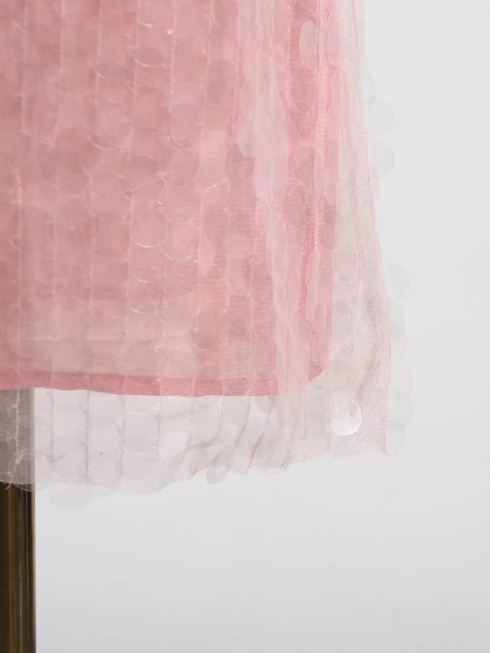 Pink iridescent sequin halter mini dress with sheer overlay detail.