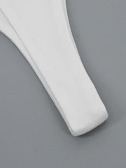 White flowy maxi dress detail showing wide strap and hem.