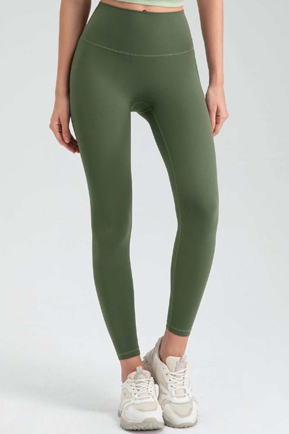 Green high rise leggings with a seamless waistband and ankle length