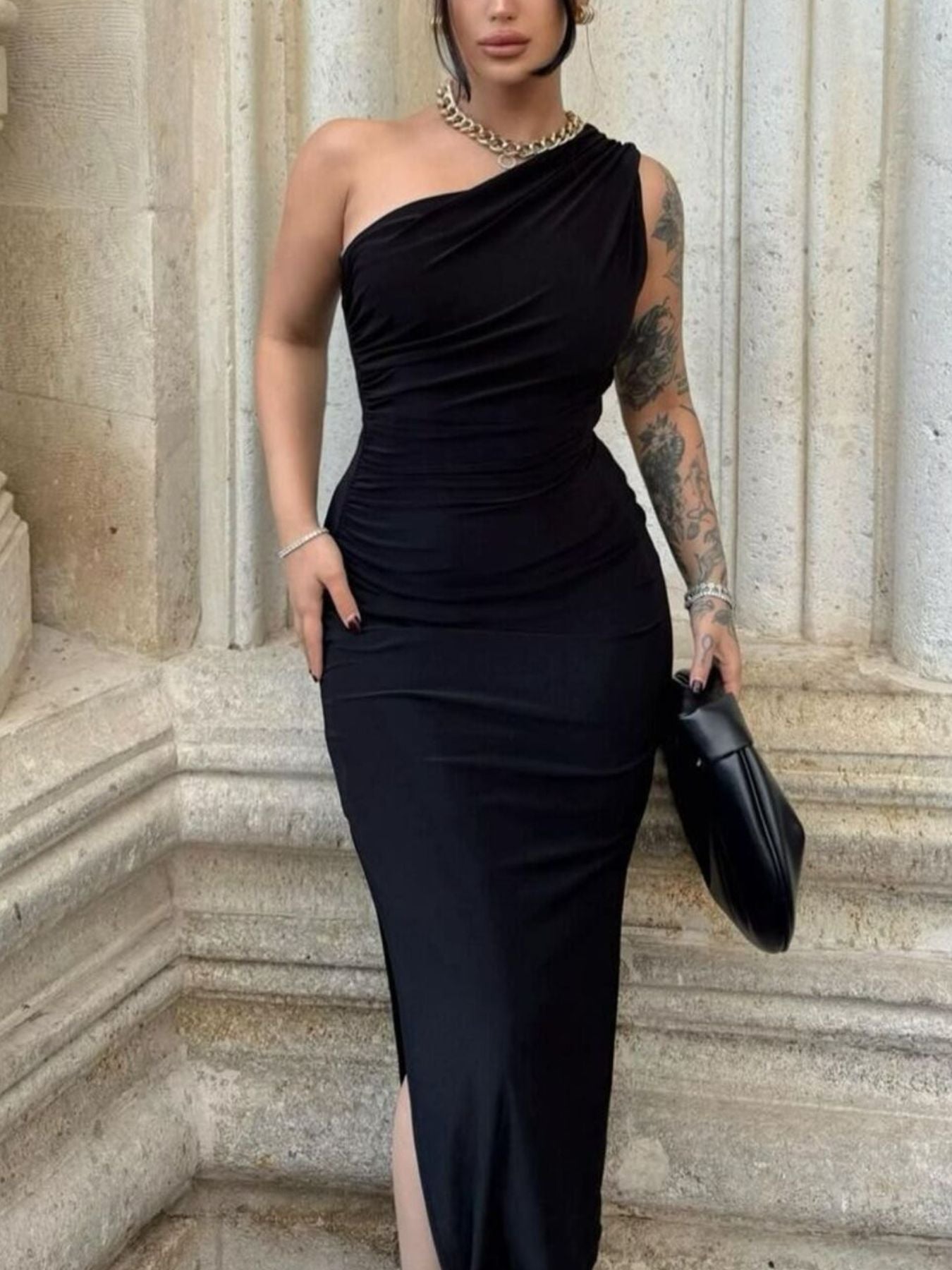 Black one-shoulder ruched bodycon midi dress with a side slit.