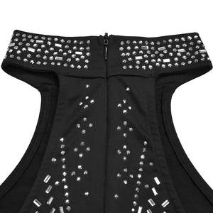 Black halter romper with rhinestone embellishments and zipper detail.