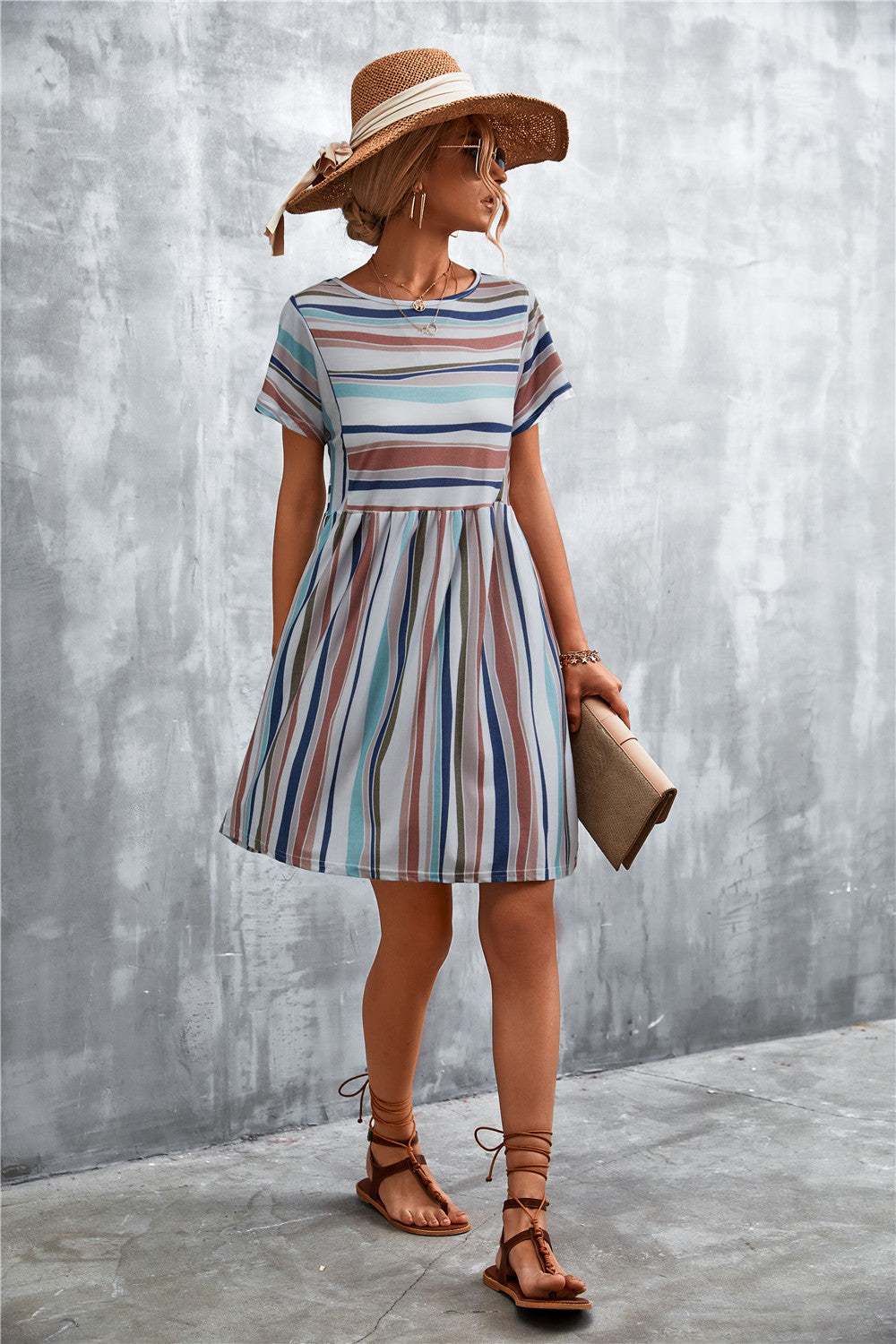 Striped yoke-seam trapeze dress with short sleeves and a round neckline.