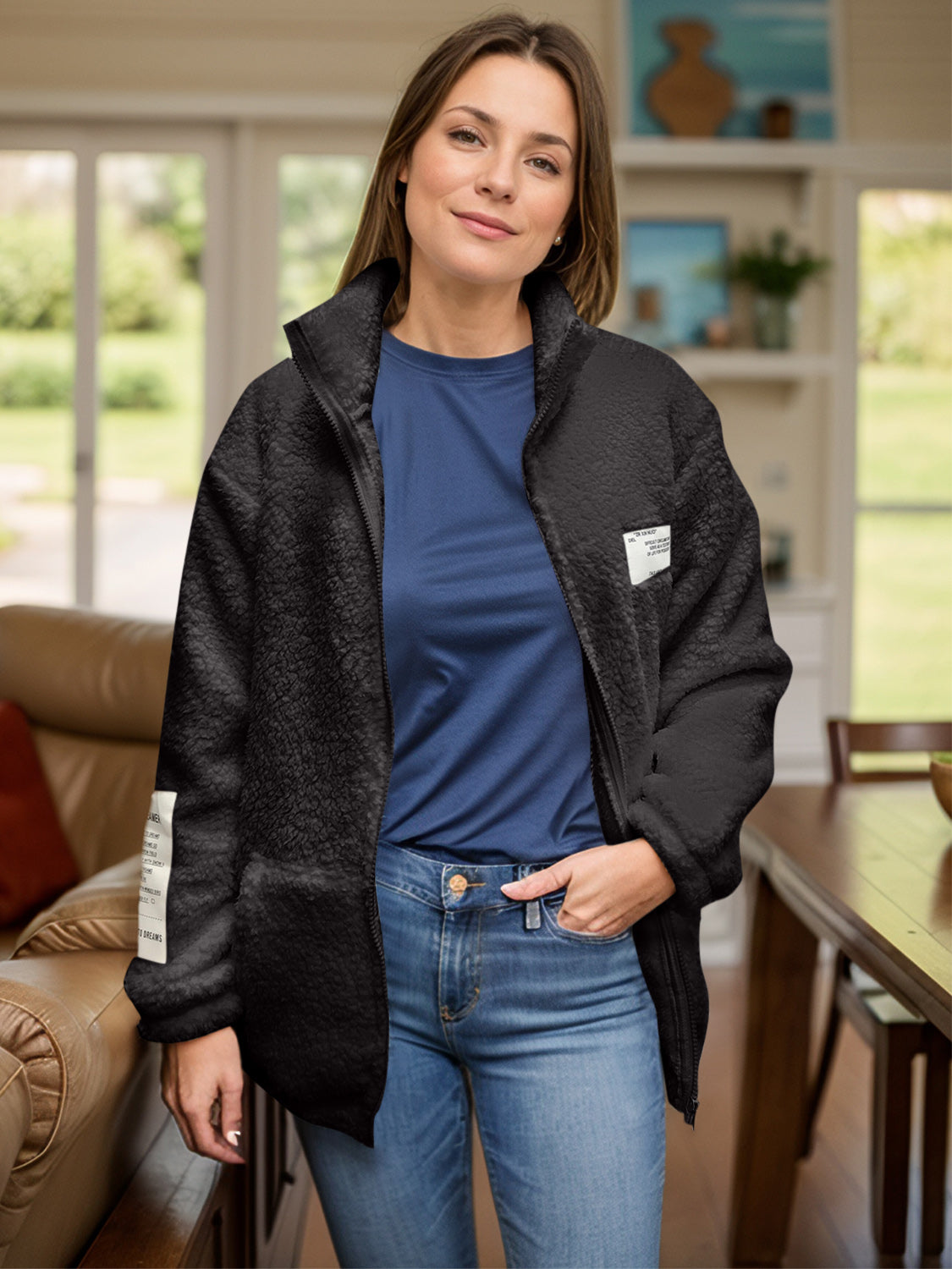 Black textured sherpa zip-up jacket with stand collar and patch detail