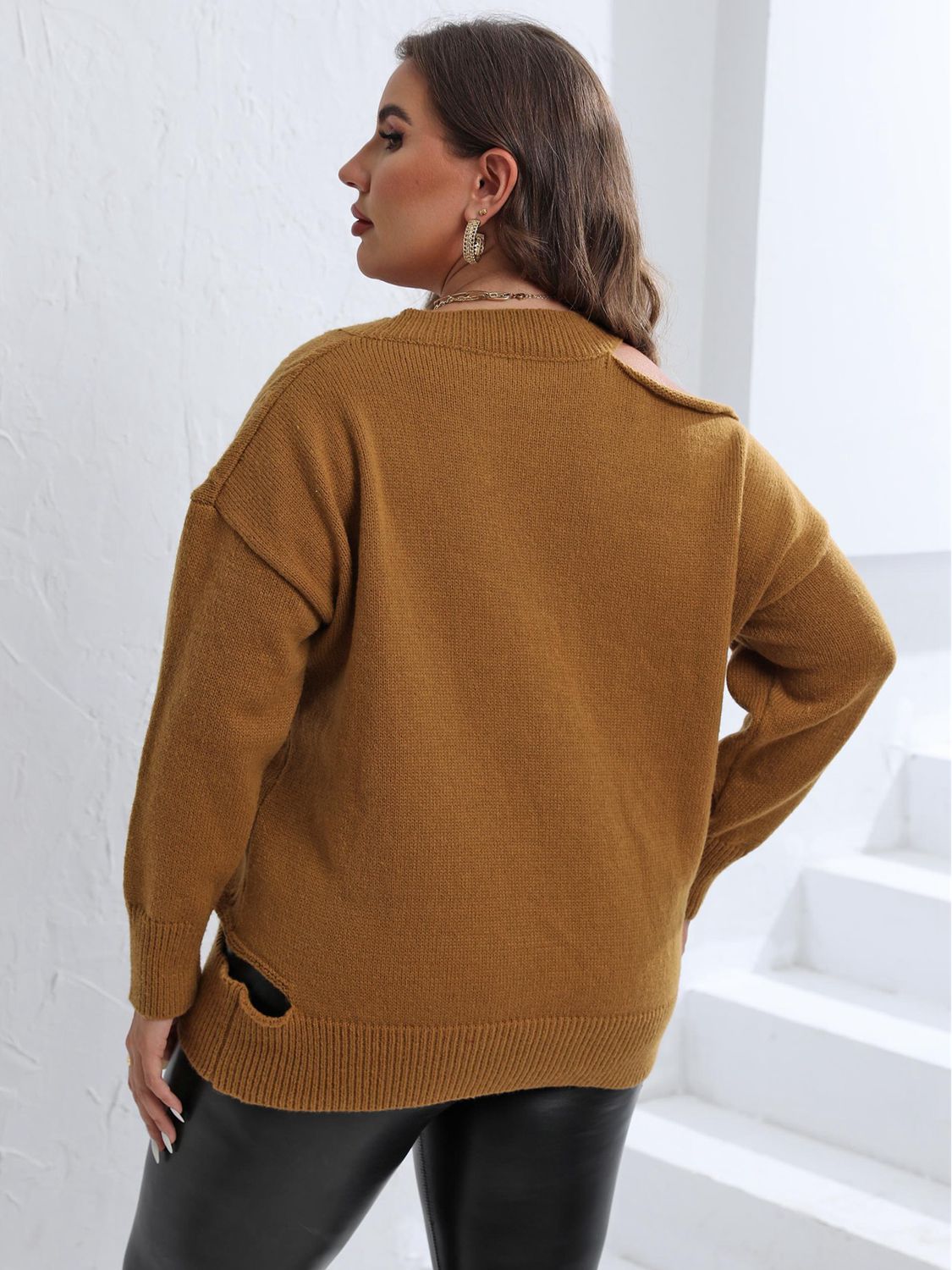 Caramel knit sweater with asymmetric shoulder detail and side slit.