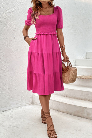 Hot pink tiered ruffle midi dress with smocked bodice and square neckline.