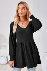 Black textured babydoll blouse with V-neck and smocked cuffs