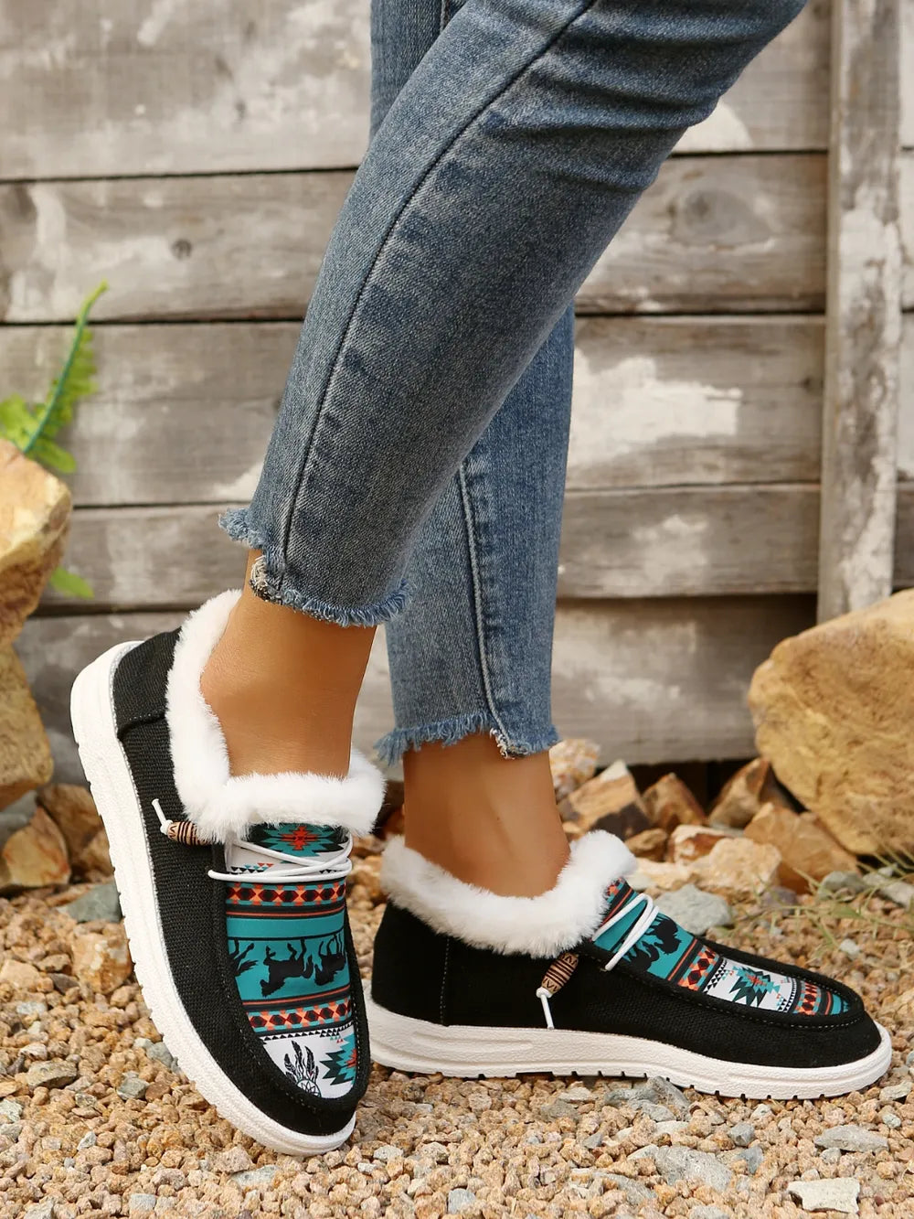 Southwestern print faux fur lined loafers in black with white trim and laces.