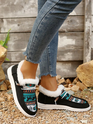 Southwestern print faux fur lined loafers in black with white trim and laces.