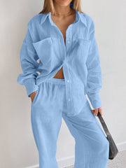 Light blue textured cotton lounge set with button-down shirt and wide-leg pants.