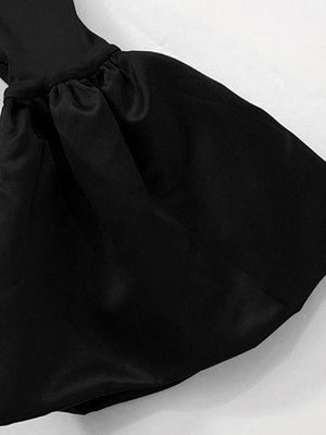 Black off-shoulder maxi dress with ruched detail and flowing skirt.