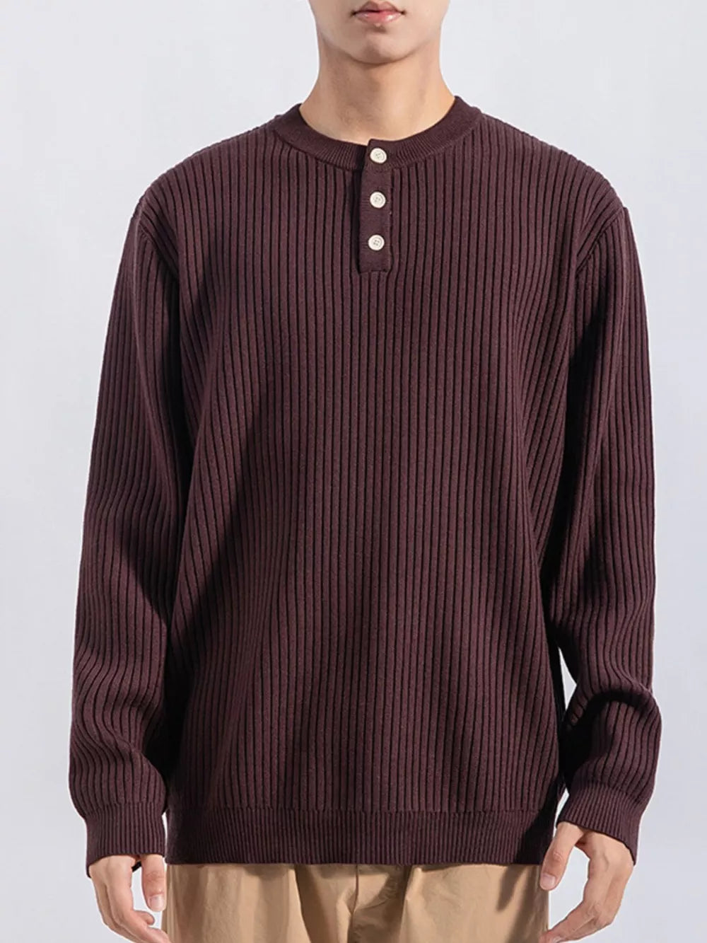 Men's ribbed knit top in dark curry with button details and crew neck.