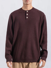 Men's ribbed knit top in dark curry with button details and crew neck.