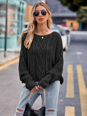 Black cable-knit acrylic sweater with a crew neck and long sleeves.