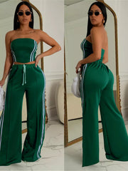 Dark green tube top and wide-leg pant set with white stripe detail and drawstring waist.
