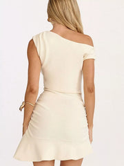 White asymmetrical ruffle hem mini dress with ruched detail and one-shoulder neckline.