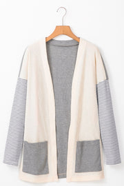 Colorblock stripe sleeve cardigan in light gray with waffle knit body and two front pockets.