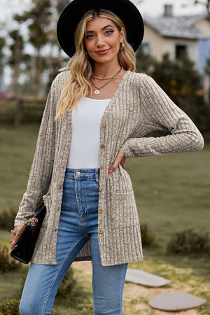 Longline ribbed knit button-down cardigan in beige with pockets and a V-neck.