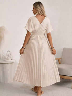 Apricot pleated V-neck midi dress with short sleeves and a smocked waist.