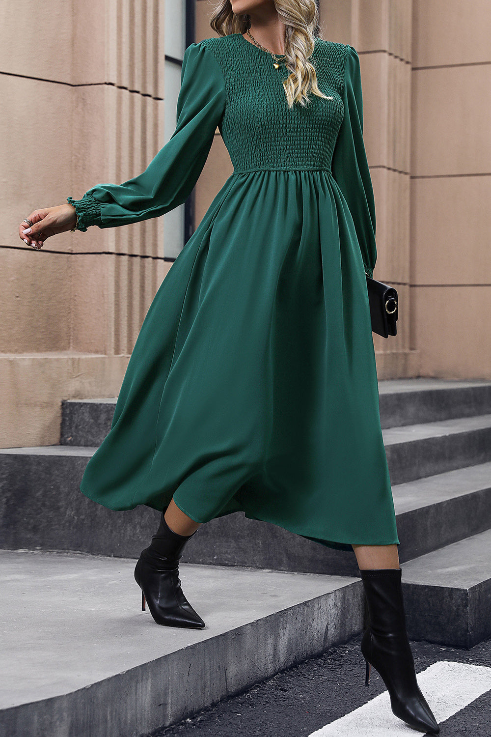 Dark green polyester midi dress with smocked bodice and long puff sleeves.