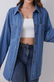 Vertical stripe denim overshirt in medium blue with button front and collar, styled with a white tube top and jeans.