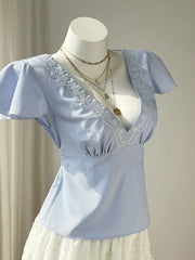 Blue striped polyester blouse with V-neck, lace trim, and flutter sleeves.