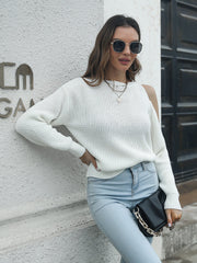 White cold shoulder knit sweater with open shoulders and a relaxed fit.