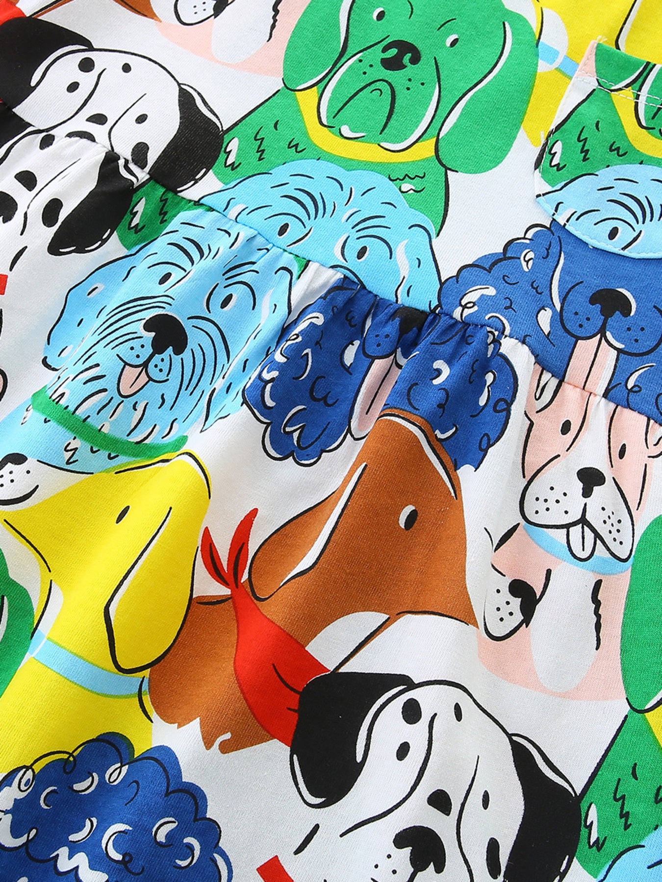 Toddler dress with a colorful cartoon dog print and gathered waist detail.