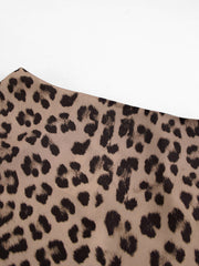 Flowy leopard print maxi skirt in beige with black animal spots.