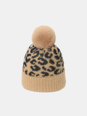 Camel leopard knit beanie with a fluffy pom and ribbed cuff.