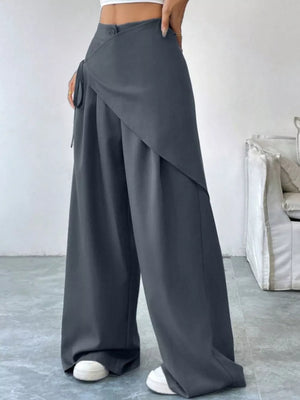 Chic dark gray maternity wide-leg trousers with a wrap detail and tie.