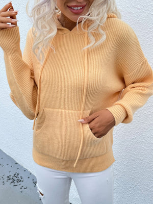 Yellow textured knit cocoon hoodie with drawstring and front pocket.