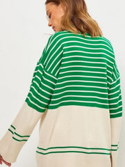 Green and cream striped knit sweater with bell sleeves and colorblock detail.