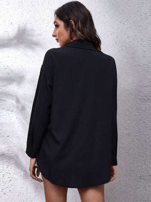 Black polyester button-down blouse with long sleeves and a collared neckline.