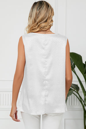 White jacquard tank top with a subtle all-over pattern, sleeveless with a drape neckline.
