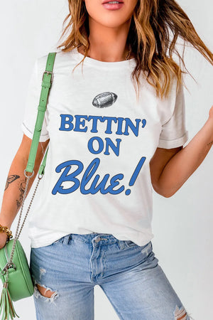 White graphic t-shirt with blue "Bettin' On Blue!" text and football graphic.