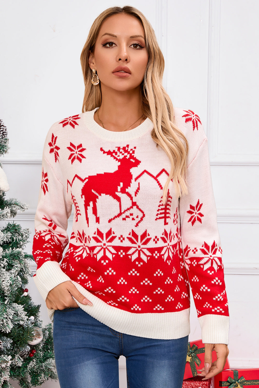 White acrylic knit sweater with red reindeer and snowflake Fair Isle pattern.