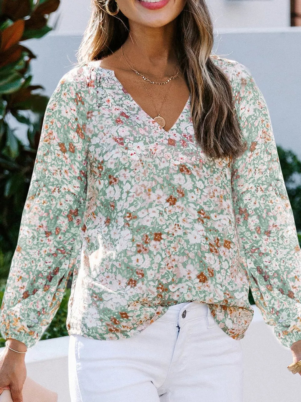 Maternity floral print green v-neck long sleeve shirt with gathered neckline.