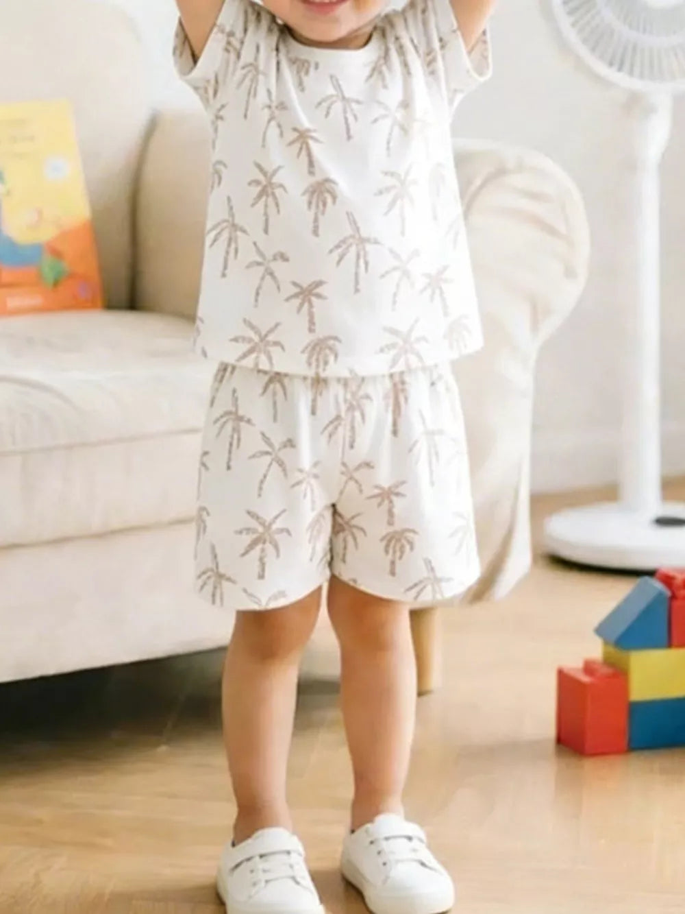 Toddler cotton blend set with tropical palm print, crew neck tee and shorts.