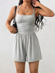 Light gray ruched spaghetti strap romper with a square neckline and elastic waist.