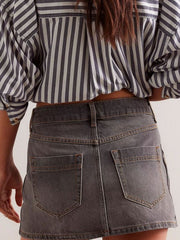 Gray denim skort with button front and five pockets.