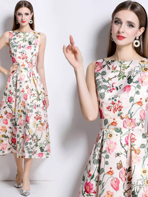 Wisteria floral print midi dress in blush pink with a-line cut and sleeveless design.