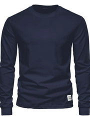 Navy crewneck long sleeve t-shirt with a small white tag detail on the hem.